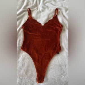 Urban Outfitters Rust colored body suit
